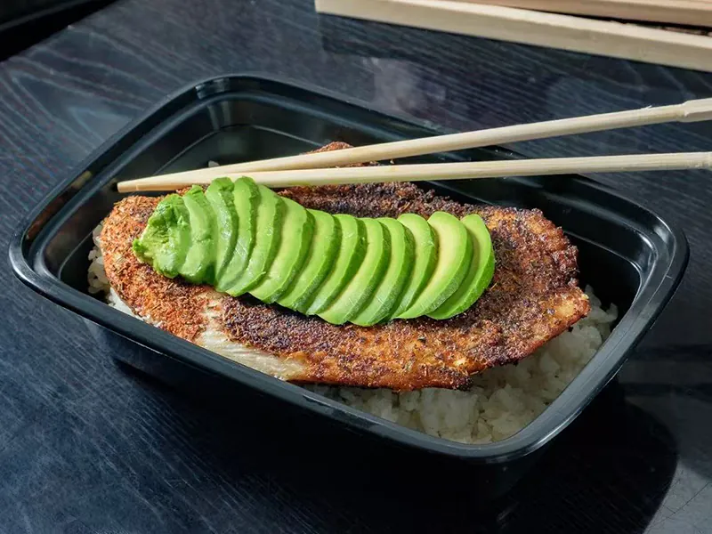 Blackened fish over rice topped with sliced avocado at Hana Sushi & Asian Cuisine, a Asian Restaurant in Maplewood