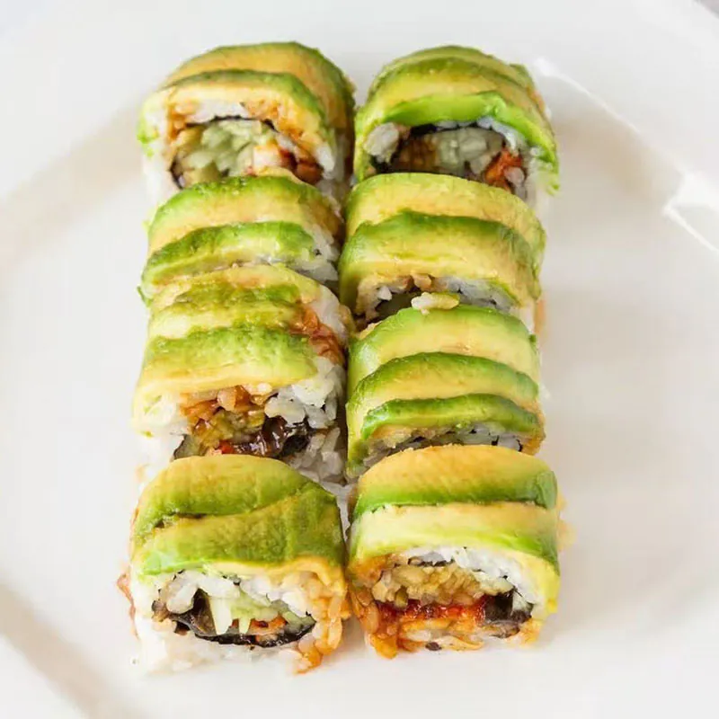 Sushi roll wrapped in fresh avocado at Hana Sushi & Asian Cuisine, a Asian Restaurant in Maplewood